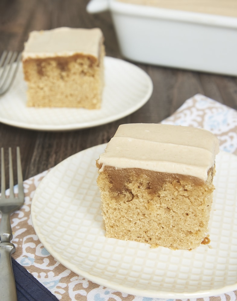 slices of Butterscotch Spice Cake on white and beige plates