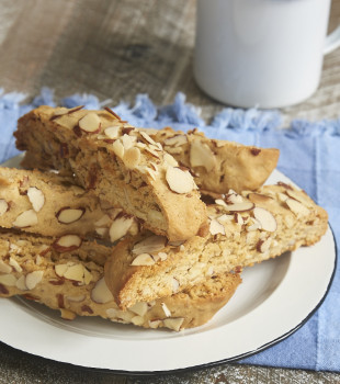 Almond Biscotti stacked on a black-rimmed white plate