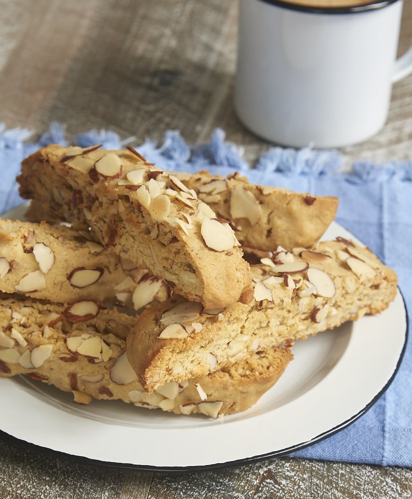 Almond Biscotti stacked on a black-rimmed white plate
