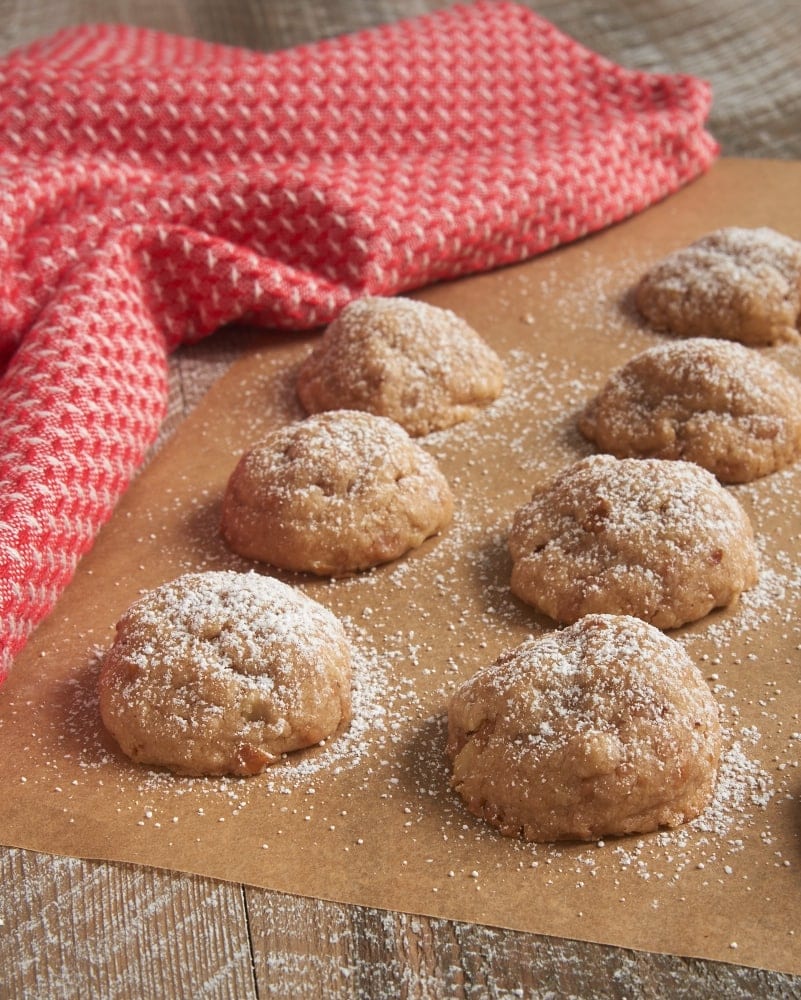 Toffee Pecan Snowdrop Cookies on parchment paper