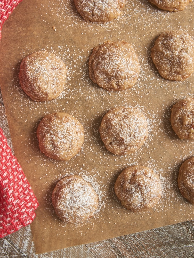 Toffee Pecan Snowdrop Cookies sprinkled with confectioners' sugar