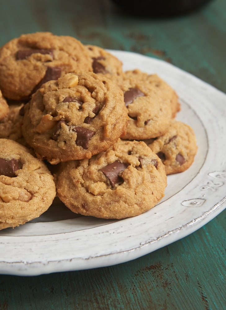 Peanut Butter Chocolate Chip Crunch Cookies on a white and gray plate
