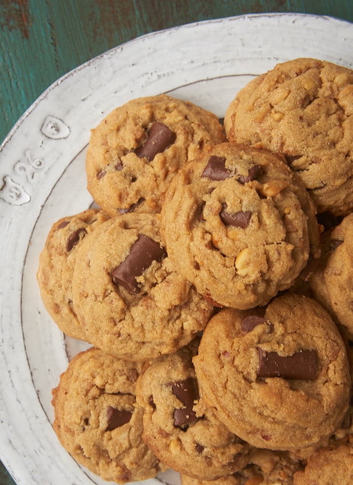 overhead view of Peanut Butter Chocolate Chip Crunch Cookies on a white and gray plate