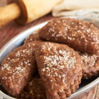 These Chocolate Hand Pies feature a rich, fudgy filling wrapped inside chocolate pie crust. Chocolate lovers will devour these! - Bake or Break