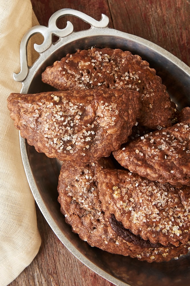 These Chocolate Hand Pies feature a rich, fudgy filling wrapped inside chocolate pie crust. Chocolate lovers will devour these! - Bake or Break