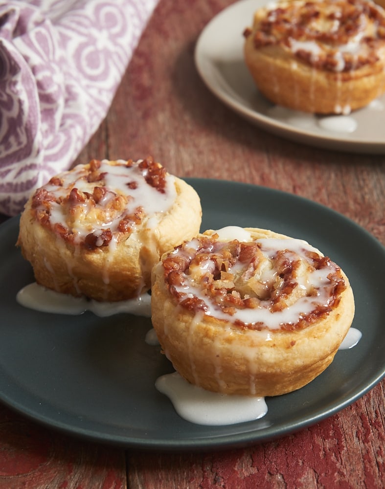 These easy-to-make Berry Cream Cheese Pastry Swirls combine cream cheese, jam, coconut, and nuts inside a rolled pastry for a delightful treat. Perfect for breakfast, brunch, or an afternoon snack! - Bake or Break