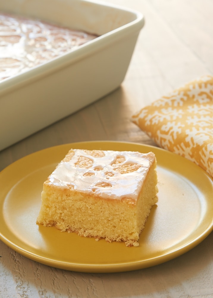 slice of Lemon Pound Cake Bars on a yellow plate