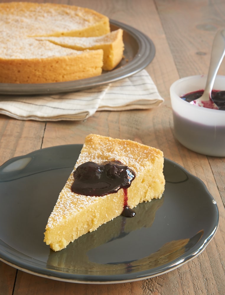 slice of Almond Gateau Breton topped with blueberry compote