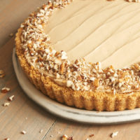 Brown Sugar Banana No-Bake Cheesecake topped with chopped pecans