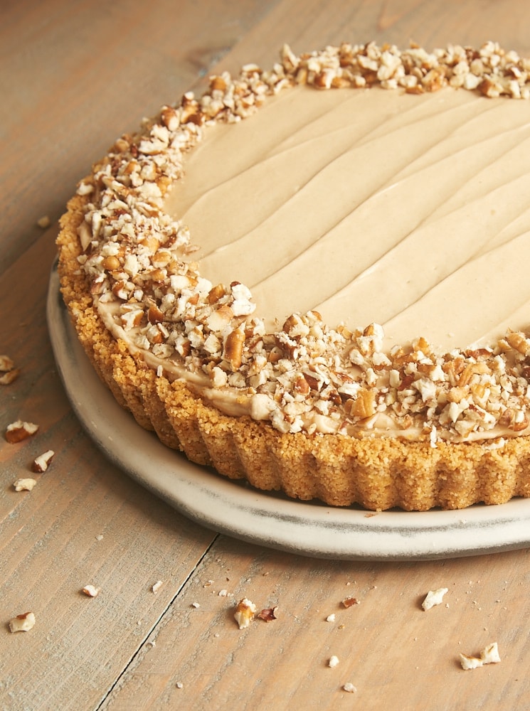 Brown Sugar Banana No-Bake Cheesecake topped with chopped pecans