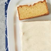 Slice of brown butter cake cut from loaf