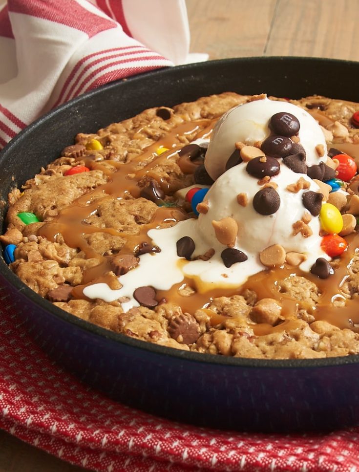 Quick to make and sure to please, this Monster Skillet Cookie is packed with all kinds of tasty things! - Bake or Break