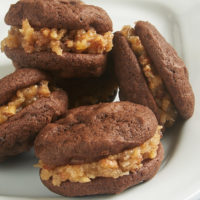 Soft, fudgy cookies combine with a sweet, nutty frosting to make these fantastic Chocolate Coconut Pecan Sandwich Cookies. If you love traditional German Chocolate Cake, these are the cookies for you! - Bake or Break