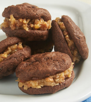 Soft, fudgy cookies combine with a sweet, nutty frosting to make these fantastic Chocolate Coconut Pecan Sandwich Cookies. If you love traditional German Chocolate Cake, these are the cookies for you! - Bake or Break