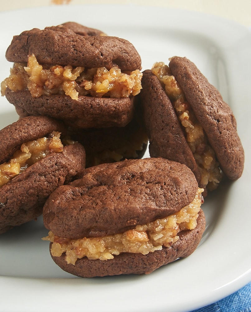 Chocolate Coconut Pecan Sandwich Cookies on a white plate