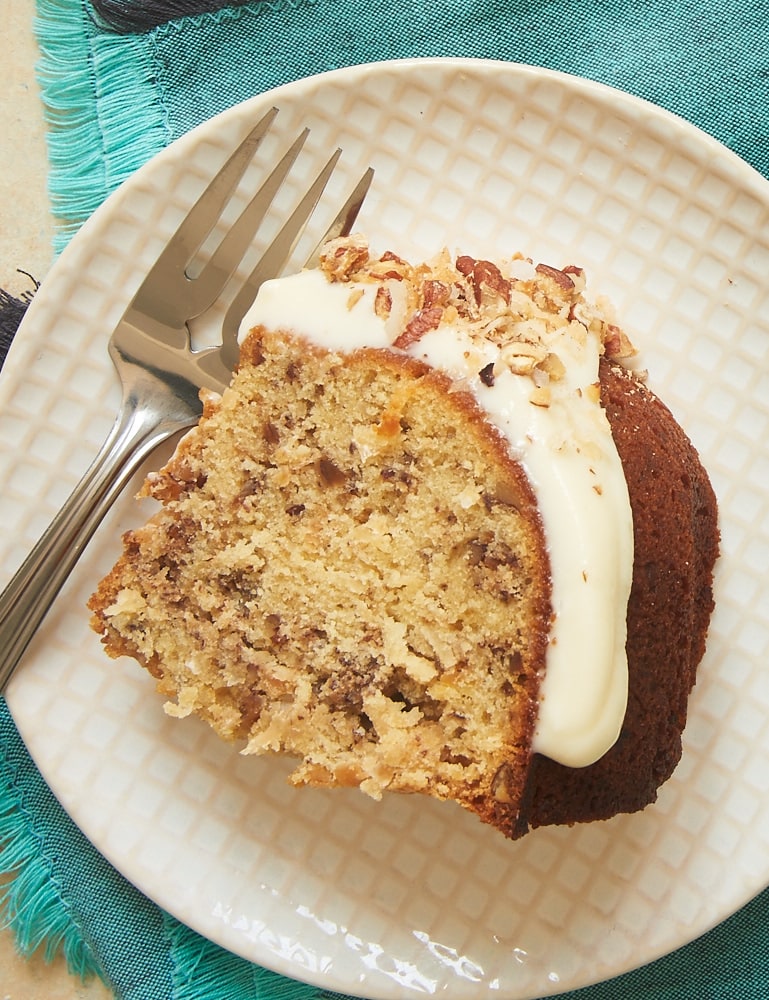 Coconut, pecans, and a cream cheese glaze make this Italian Cream Bundt Cake a winner. Such a great, simple twist on a classic dessert! - Bake or Break