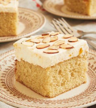 Brown Butter Almond Cake with Apricot Whipped Cream on a brown floral plate