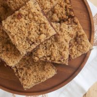 Cinnamon Crumb Brownies on a wooden serving plate