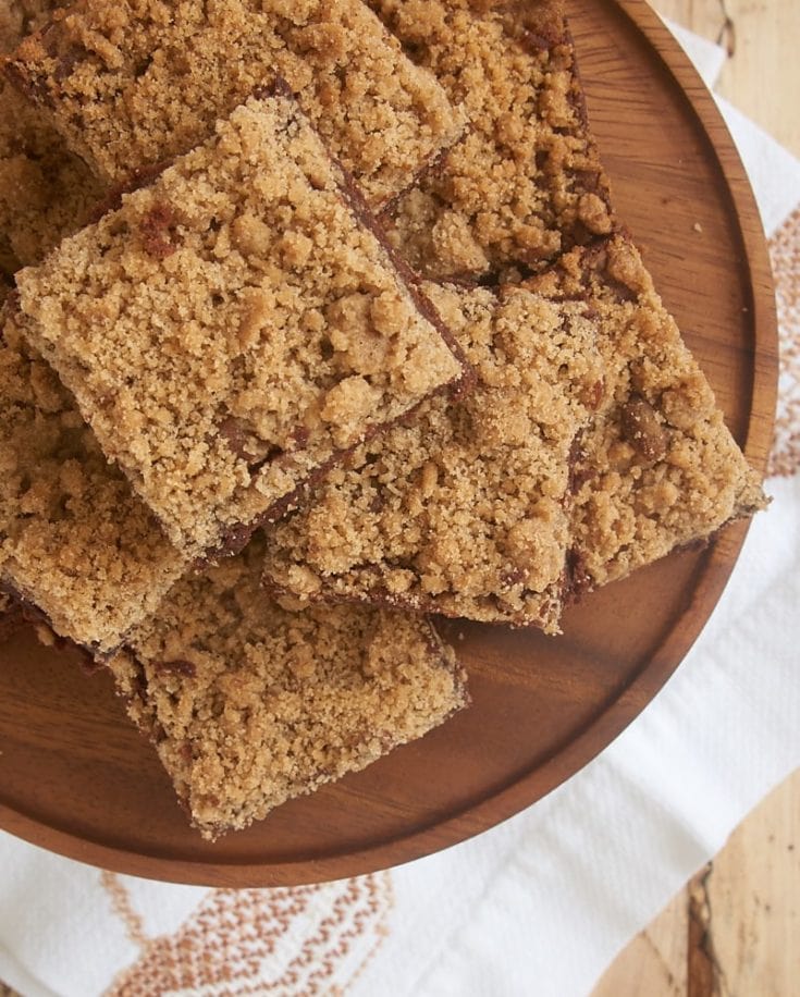 Cinnamon Crumb Brownies on a wooden serving plate