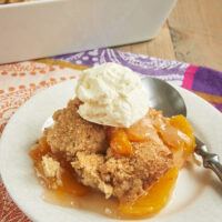 Ginger adds a bit of spice, and pecans contribute some crunch to this fantastic Ginger Pecan Peach Cobbler. - Bake or Break