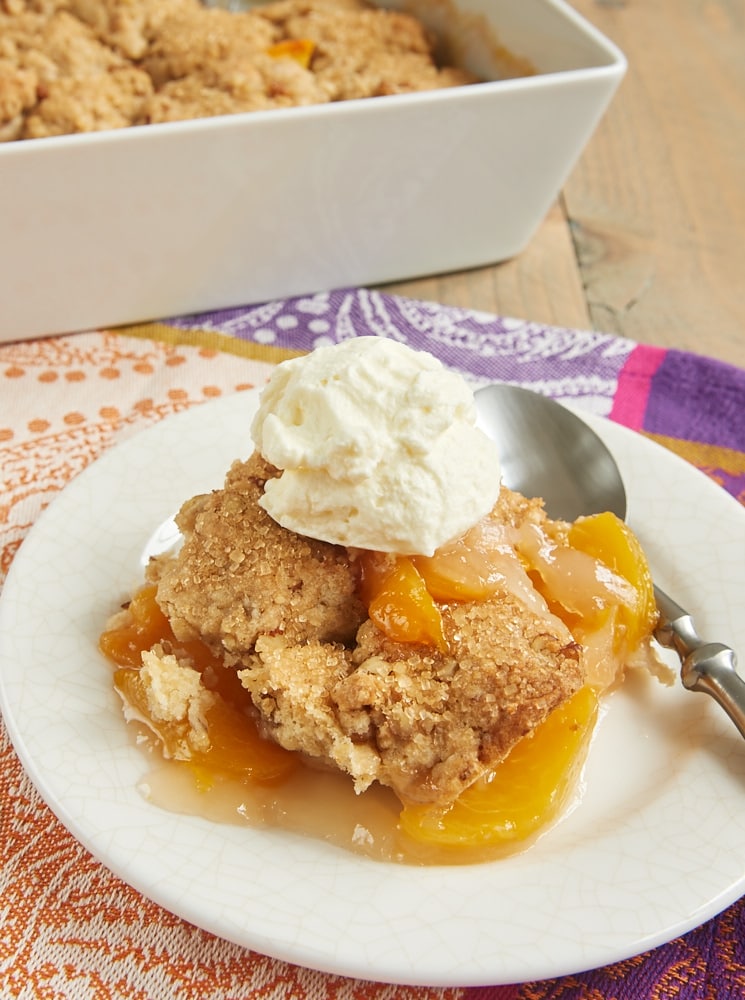 Ginger adds a bit of spice, and pecans contribute some crunch to this fantastic Ginger Pecan Peach Cobbler. - Bake or Break