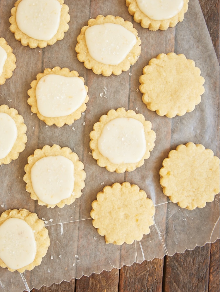 Peach shortbread cookies on parchment paper.