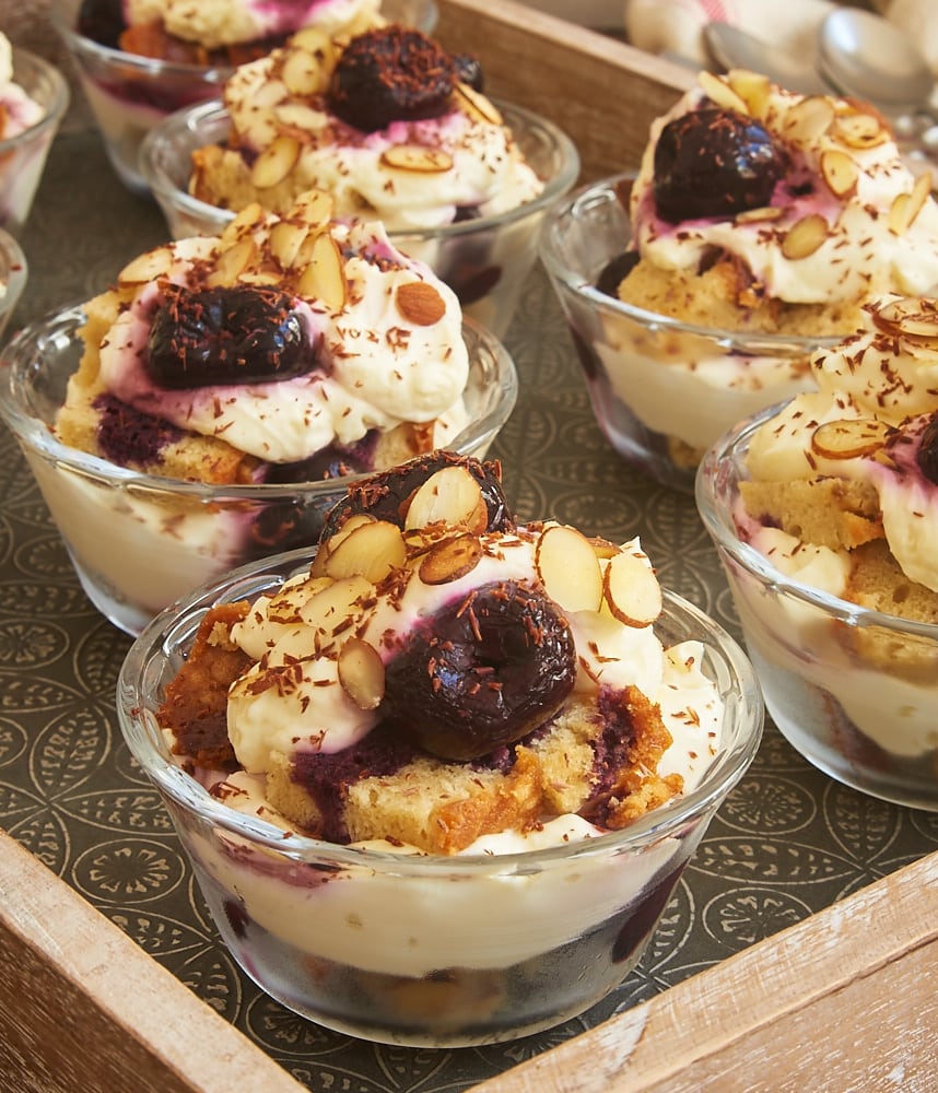 Layers of pound cake, cream cheese whipped cream, brandied cherries, nuts, and chocolate make these Brandied Cherry Trifles irresistible! - Bake or Break