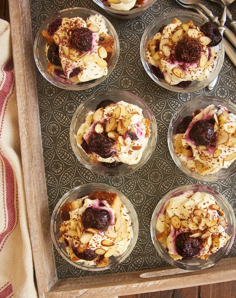 Layers of pound cake, cream cheese whipped cream, brandied cherries, nuts, and chocolate make these Brandied Cherry Trifles irresistible! - Bake or Break