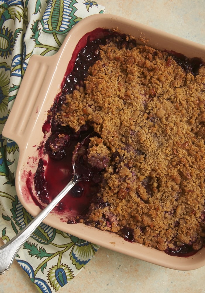 Sweet cherries and berries combine with a nutty, brown sugar crumb topping for this quick, easy, and delicious Cherry Berry Crumble. - Bake or Break.