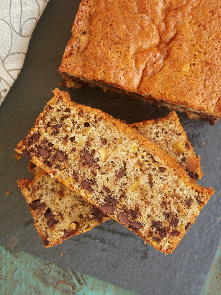 overhead view of Chocolate Chip Pistachio Pound Cake on a black cutting board