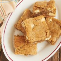 Peanut Butter White Chocolate Blondies are so soft, nutty, and delicious. One little extra ingredient makes them irresistible! - Bake or Break