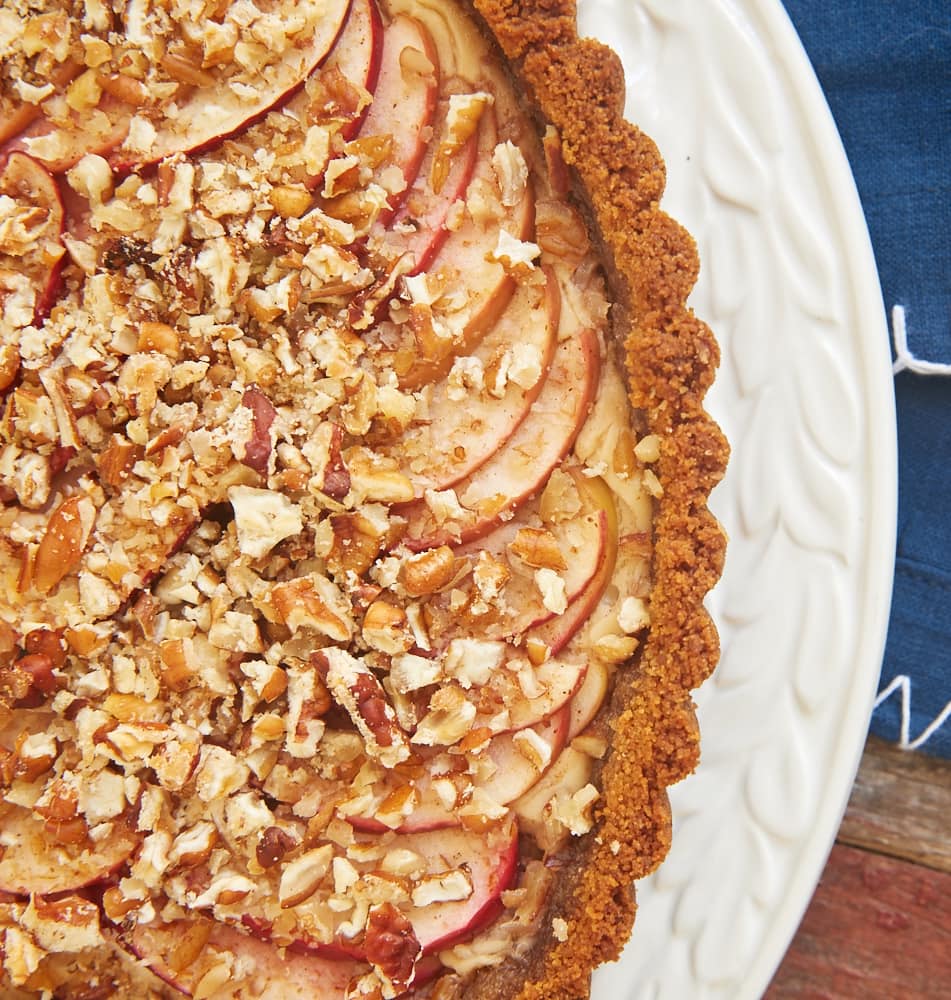 Apple Pecan Cream Cheese Tart is a delicious combination of apple pie and cheesecake. This lovely dessert is a fall baking must! - Bake or Break