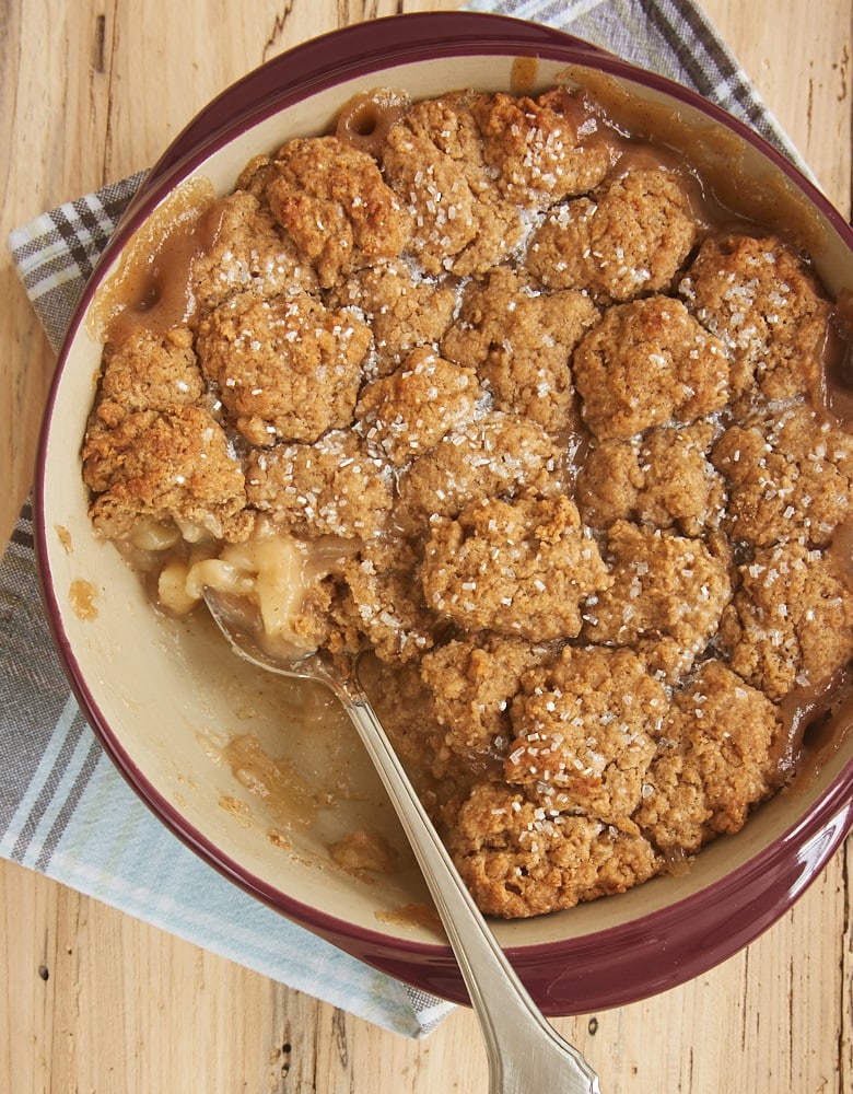 Autumn Spice Pear Cobbler in a red ceramic baker