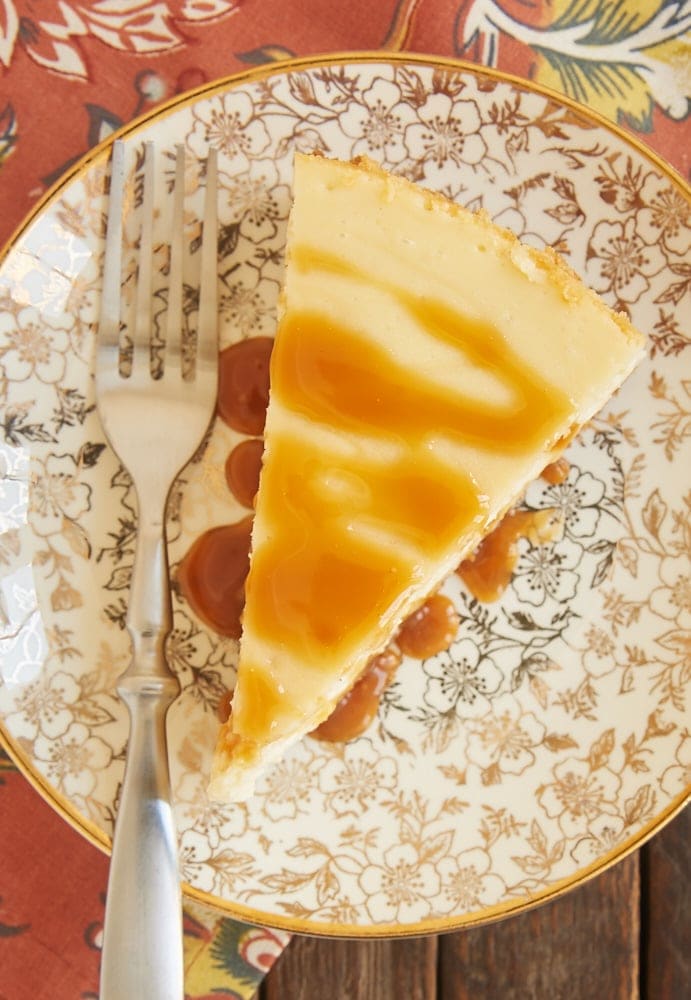 Bourbon Caramel Swirl Cheesecake topped with a drizzle of caramel