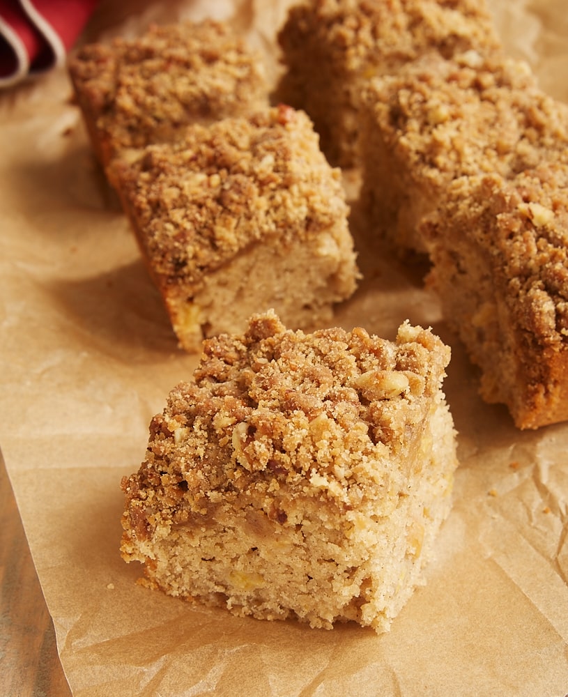 slices of Caramel Apple Crumb Cake on parchment paper