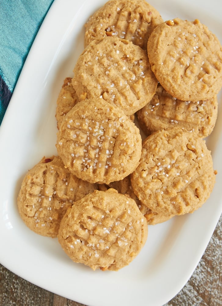 Cream Cheese Peanut Butter Cookies scattered on a white tray