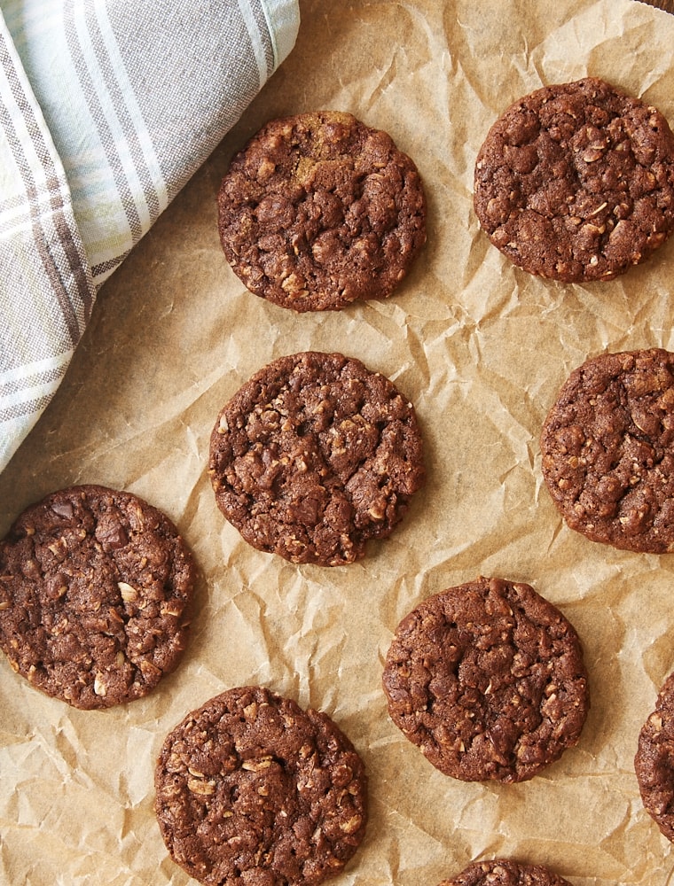 overhead view of Chocolate Oatmeal Biscoff Cookies on parchment paper