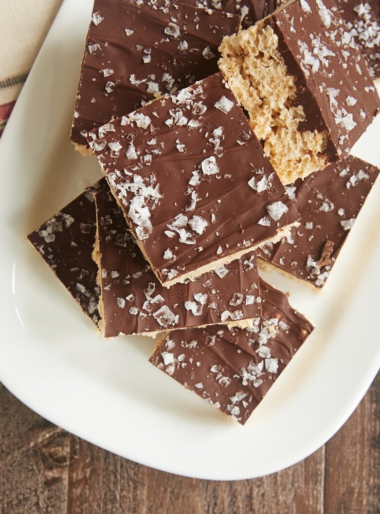Salted Chocolate Brown Butter Crispy Treats stacked on a white tray