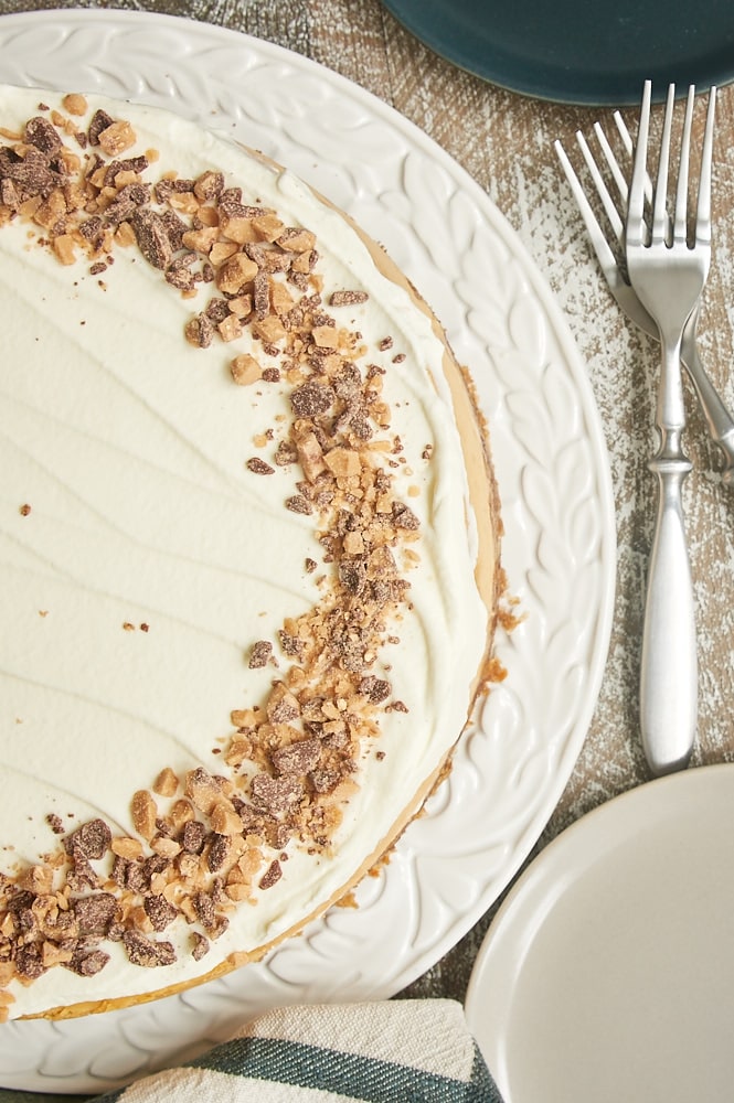 overhead view of Brown Sugar Caramel Cheesecake with Oatmeal Cookie Crust on a round white serving tray