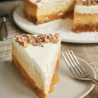 slice of Brown Sugar Caramel Cheesecake on a light gray plate