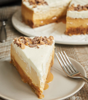 slice of Brown Sugar Caramel Cheesecake on a light gray plate