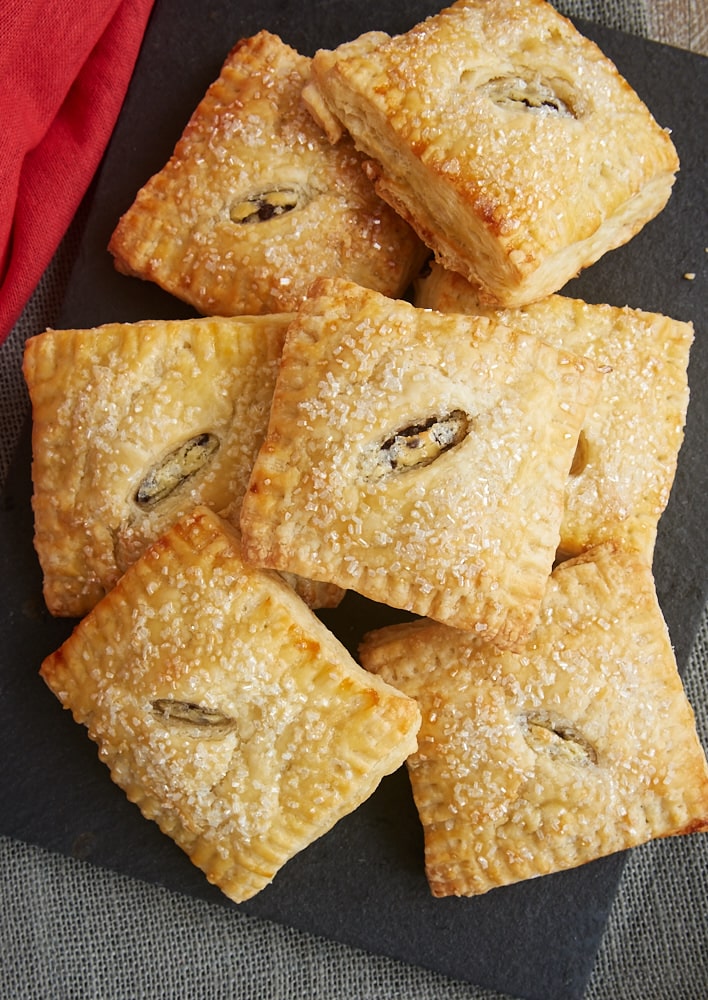 These Chocolate Chip Cream Cheese Hand Pies feature a sweet, chocolate-chip-filled cream cheese filling surrounded by buttery pie crust. They are amazingly delicious! - Bake or Break
