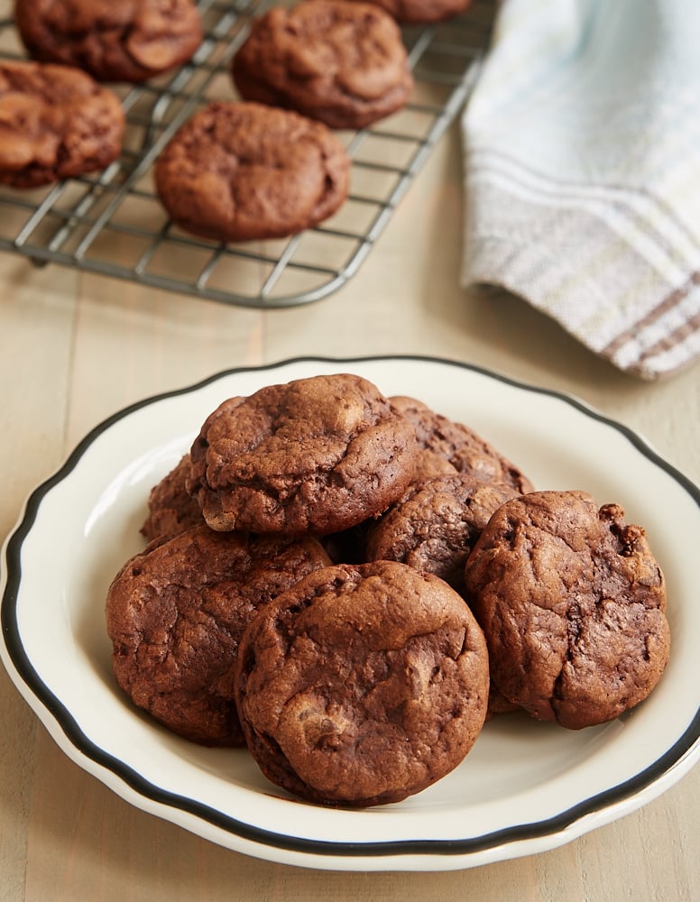 Irish Cream Brownie Cookies piled on a black-rimmed white plate