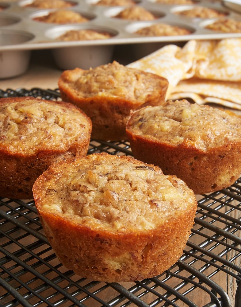 Pineapple Coconut Banana Nut Muffins on a wire rack