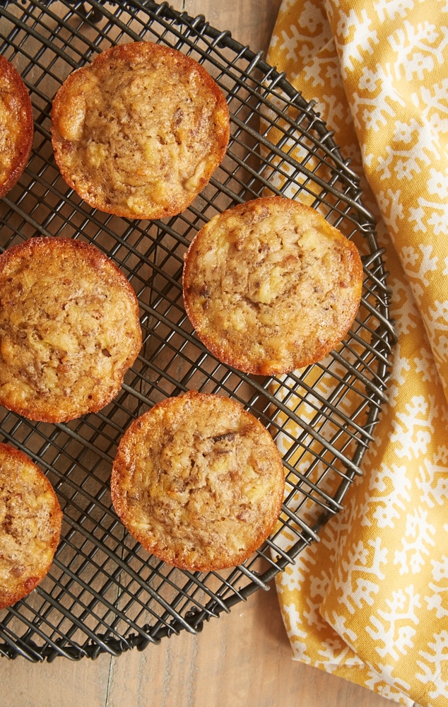 overhead view of Pineapple Coconut Banana Nut Muffins on a round wire rack