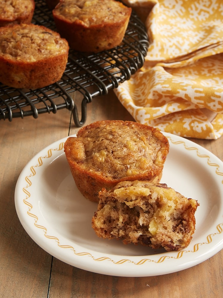 Pineapple Coconut Banana Nut Muffins on a white plate with yellow trim