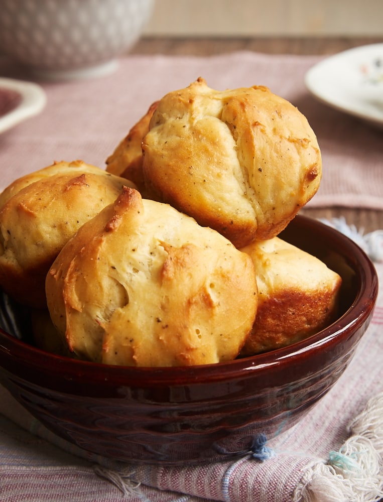 Cracked Pepper Sour Cream Rolls in a brown bowl