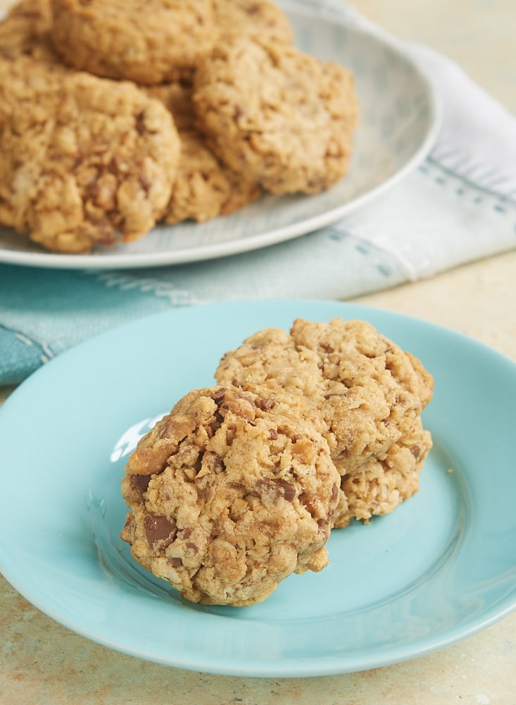 stack of Peanut Butter Toffee Oatmeal Cookies on a blue plate