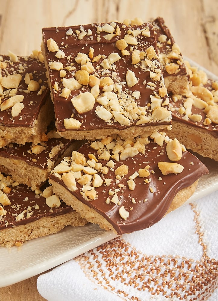 Chocolate peanut butter shortbread cookies topped with peanuts.