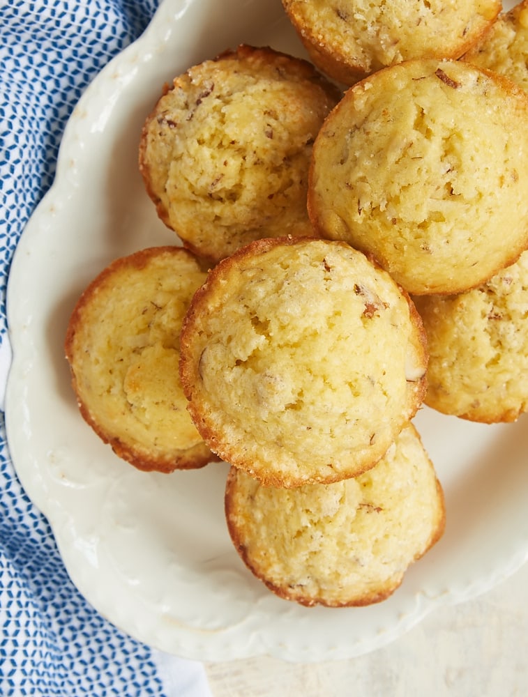 overhead view of Coconut Almond Muffins on an oval white tray